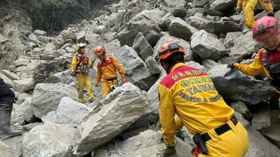 Taiwan rescuers free nine from cave after quake