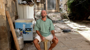 Survivor recalls watching Israel festival massacre from atop a tree