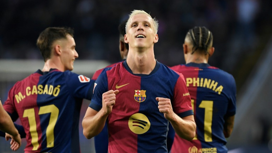 Olmo double helps Liga leaders Barca to derby win over Espanyol