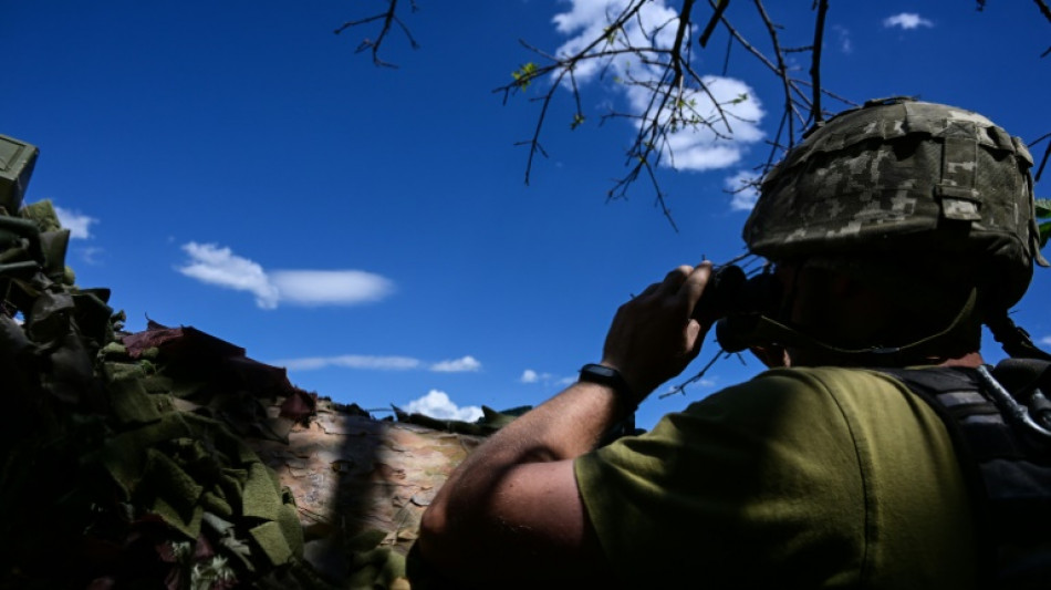 In east Ukraine trench, soldiers dig in for 'total war'