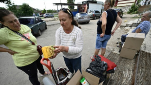 Desperate Ukrainians risk Russian shelling in food queues