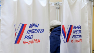 Polls open in Russian vote to extend Putin's reign