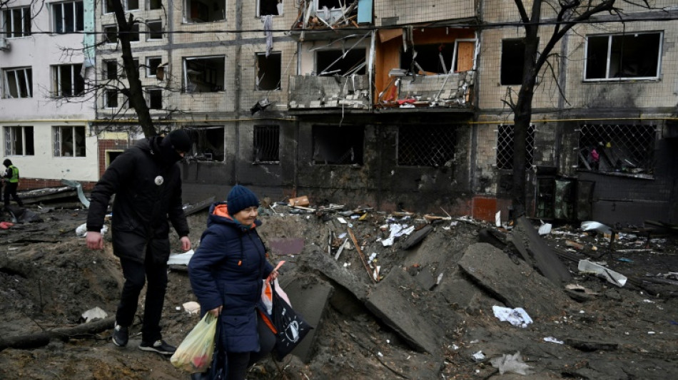 Strikes on Kyiv wound dozens as Ukraine pleads for aid