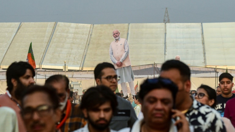 Modi's struggling rival Gandhi votes as India election resumes