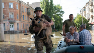 'You can't even see the roof': Ukrainians flee dam flood