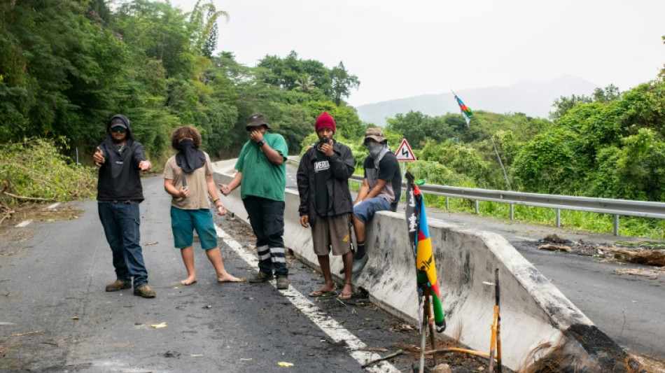 Schools, cars burn in New Caledonia ahead of Macron visit