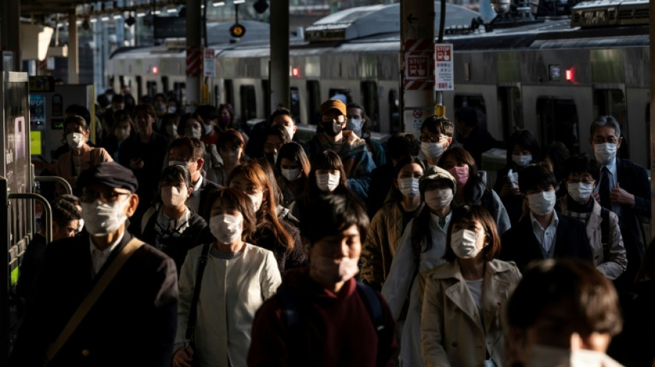 Japan eases mask guidelines, but few are keen to change