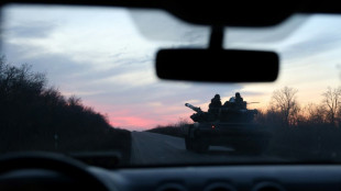 Russia throwing 'waves' of men in battle for key frontline city