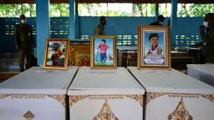 Thai king tells massacre victims' families 'I share your grief'