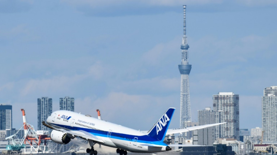 Japan's top airline ANA reports first net profit in 10 quarters