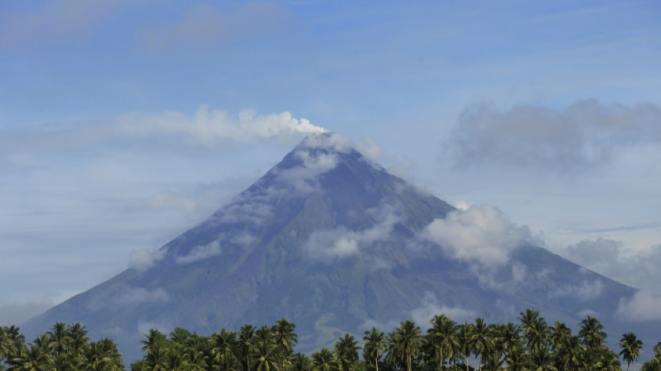 Rescuers climb Philippine volcano to reach plane crash site