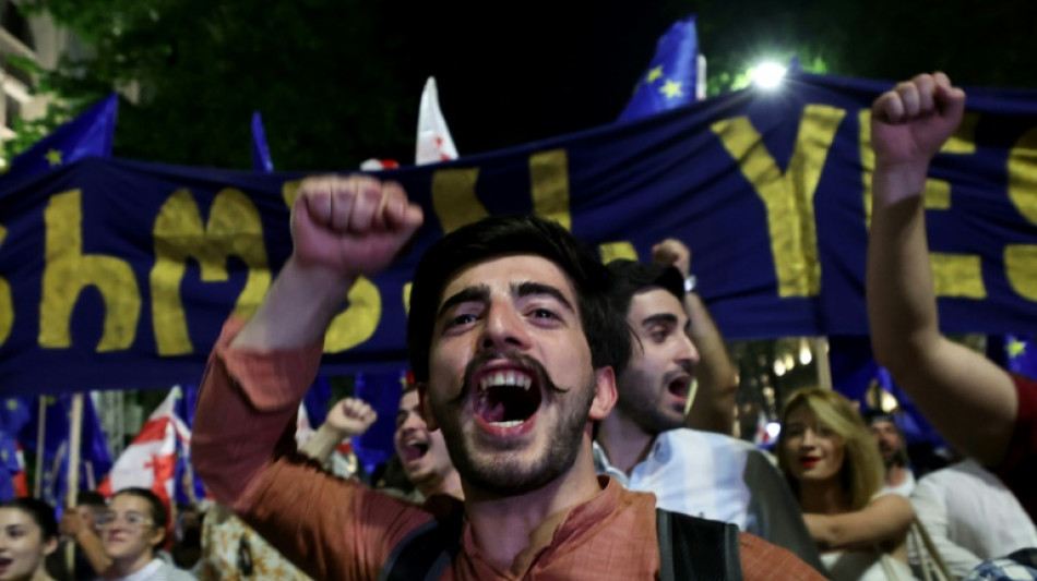 Thousands of Georgians protest controversial draft law