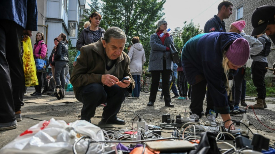 Makeshift wifi spot reconnects shattered Ukraine city