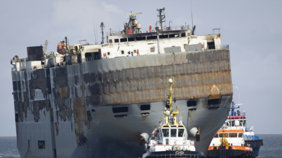 Burnt-out car transport ship limps into Dutch port