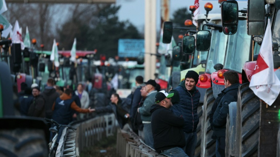 Fuming French farmers pile pressure on Paris