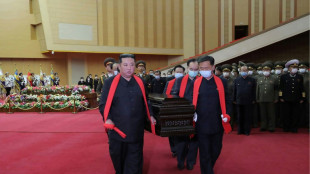 Kim Jong Un carries coffin at N. Korean military officer's funeral