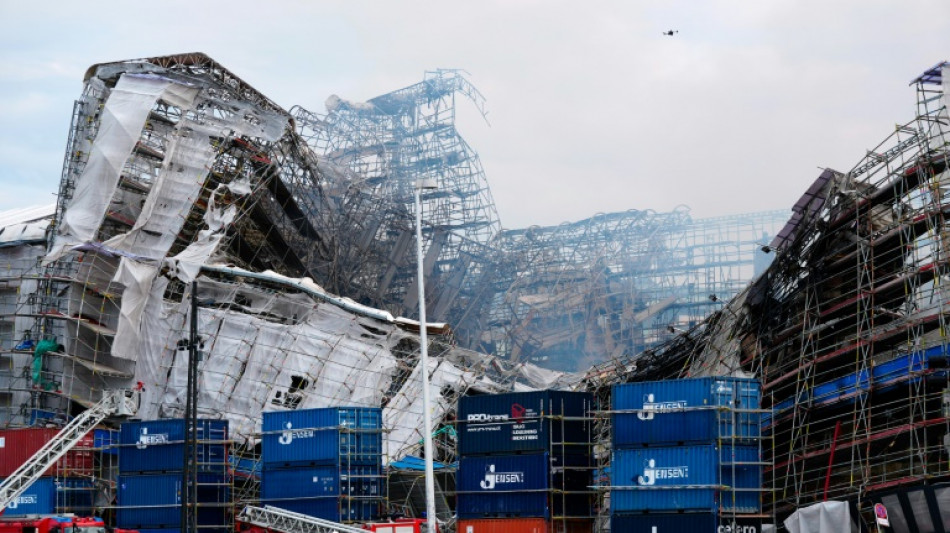 Historic Copenhagen building smolders for third day as facade collapses