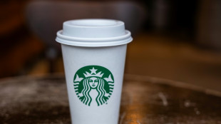 Starbucks points to weaker consumer as profit falls