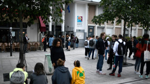 France's PM stands with teachers after school chief quits in hijab row