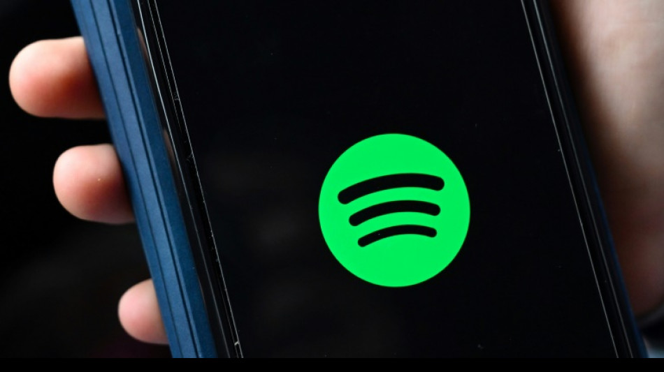 Spotify adds paid subscribers, beating estimates