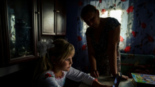 Ukraine schools return to sound of war