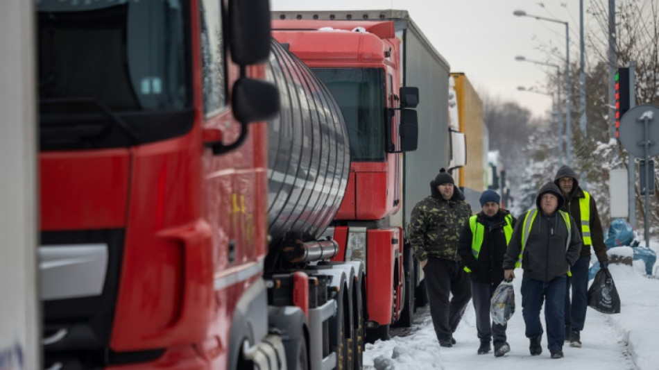 Ukrainian truckers stranded in Poland battle cold