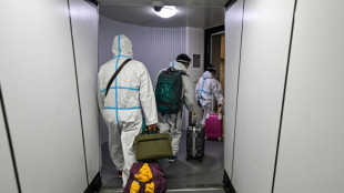 Jubilant Chinese plan trips abroad with Covid quarantines to end