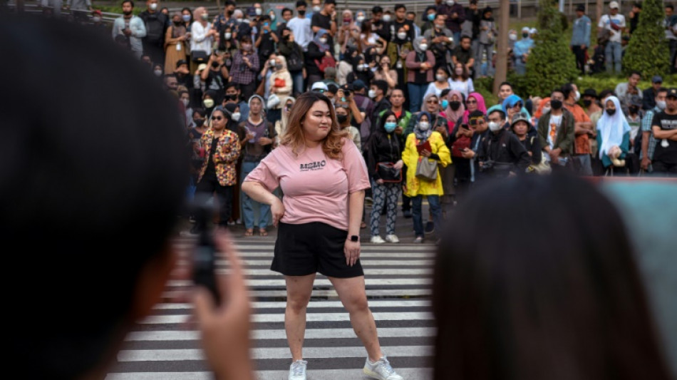 At a Jakarta crosswalk, Indonesian teens take to the catwalk