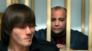 Russia pardons ex-policeman convicted of journalist's murder