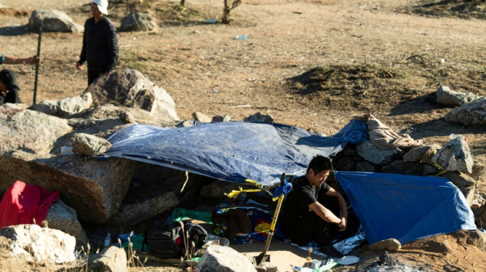 'A new normal': Migrants huddle in open-air camps on US border