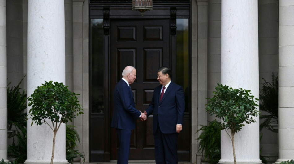 Biden, Xi vow to reduce tensions at key summit