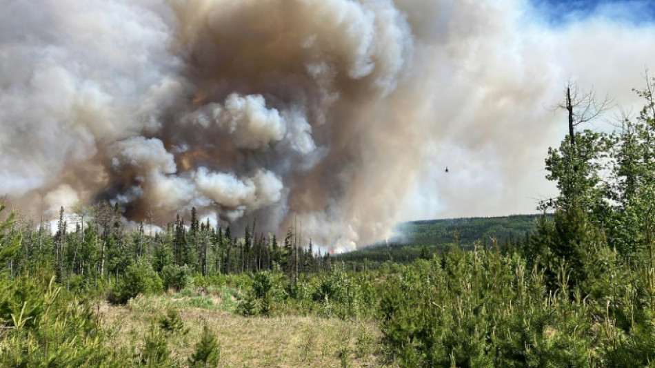 Facing unprecedented fire season, Canada confronts logistical challenge