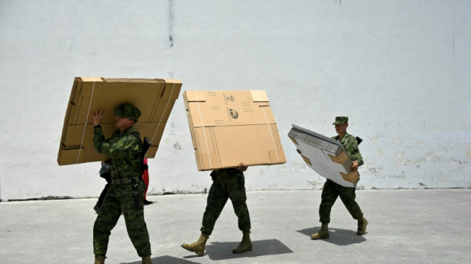 Prison chief slain as Ecuadorans vote on anti-crime measures