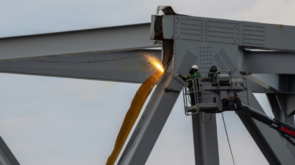 Workers remove first chunk of destroyed Baltimore bridge