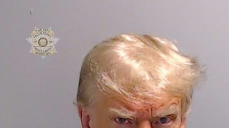 Trump arrested in election case, mug shot released