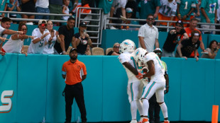 Hill sparks Dolphins comeback, Cowboys rout Browns