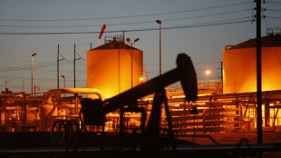 Oil prices slide, stocks diverge